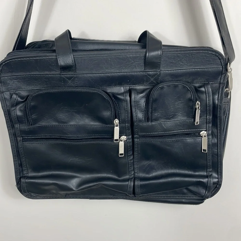 Soft bodied faux leather briefcase lots of pockets and crossbody strap